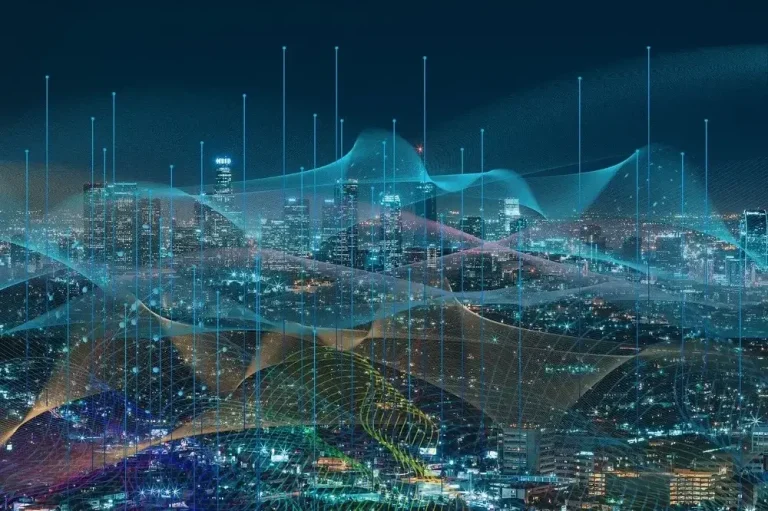 Graphic of cyber use peaks and valleys overlaying a cityscape at night.